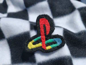 an embroidered patch of the playstation logo